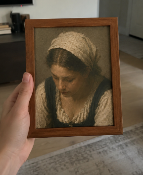 Patron holding a framed print of Girl in a Kerchief
